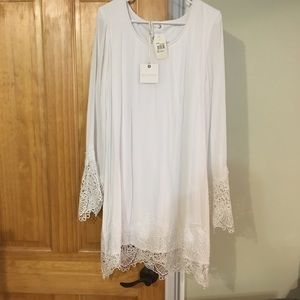 White shift dress with lace sleeves and trim